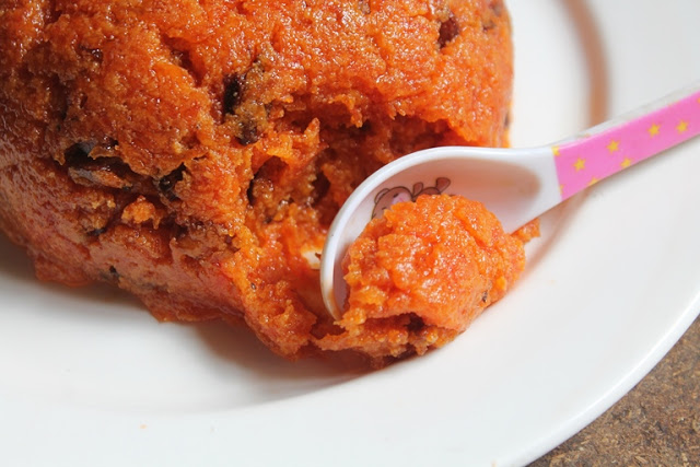 a spoonful of carrot halwa cooked with milkmaid