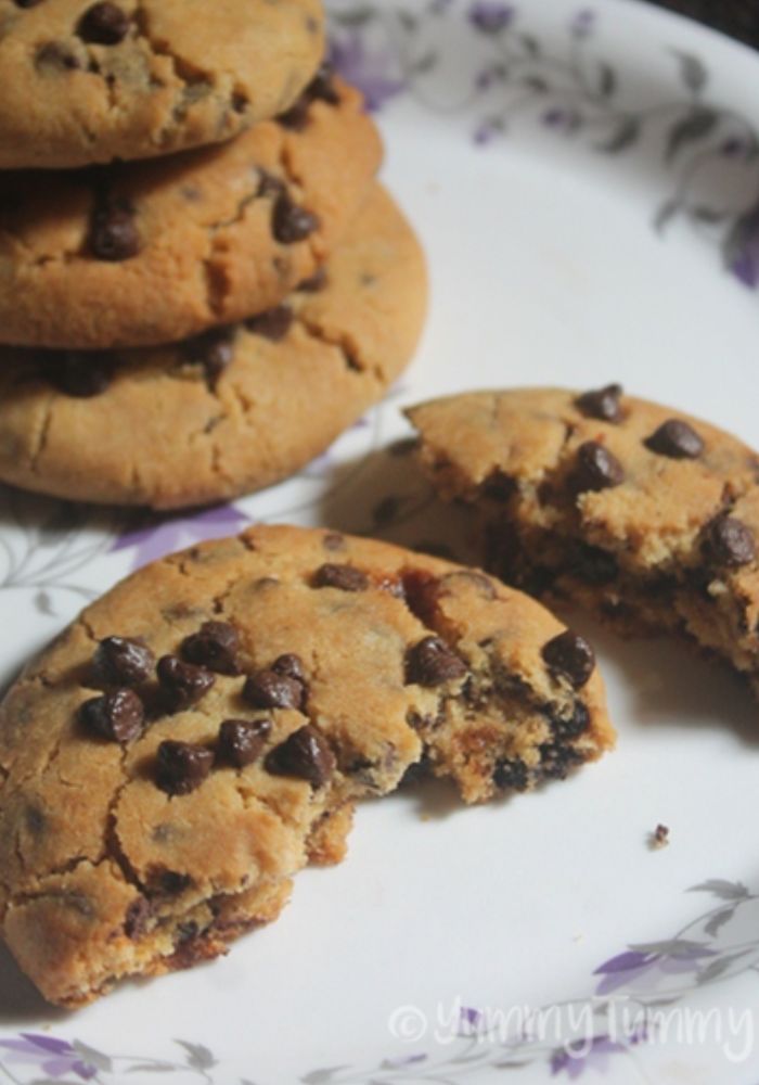 chewy eggless chocolate chip cookies broken in half 