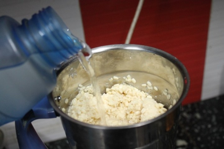 add water slowly while grinding dal