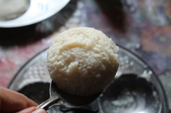 soft idli on a spoon