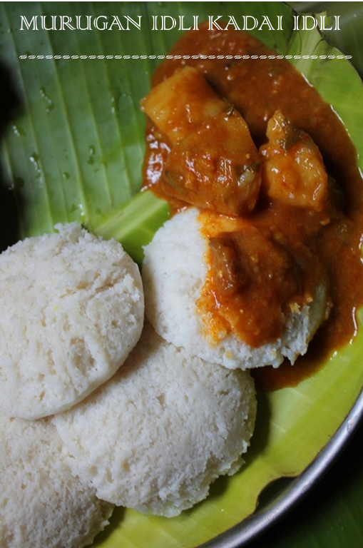 top shop of idli served on a banana leaf with medu vada, sambar and filter coffee