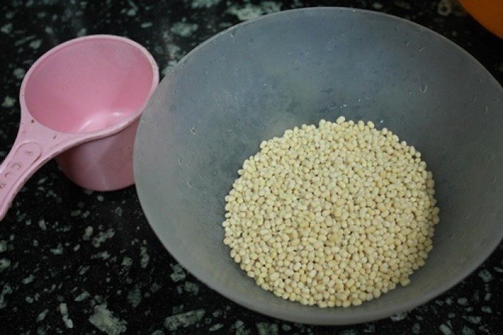 whole skinned urad dal measured and taken in a bowl
