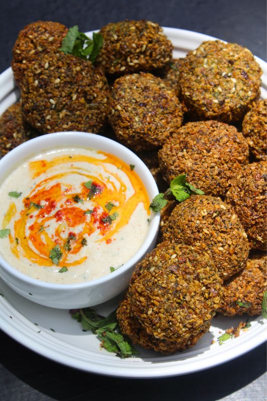 tahini sauce served with falafels with a drizzle of olive oil