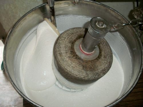 traditional stone grinder used in making idli dosa batter