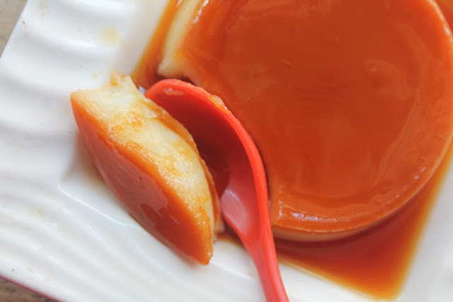 Eggless Caramel Custard texture shown with a spoon