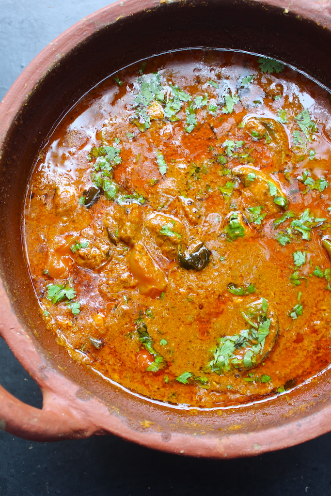 fish curry in a clay cookware