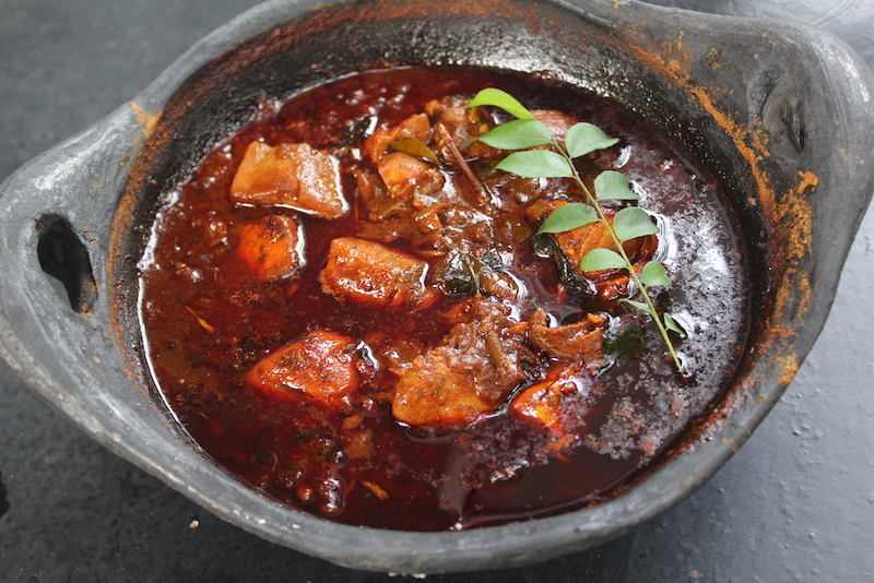 kerala meen curry made and served in clay pot