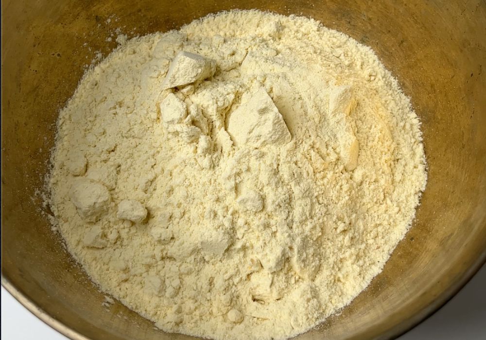 take powdered gram dal sugar mix in a bowl