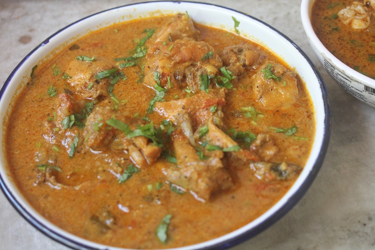 chicken kulambu served in a bowl