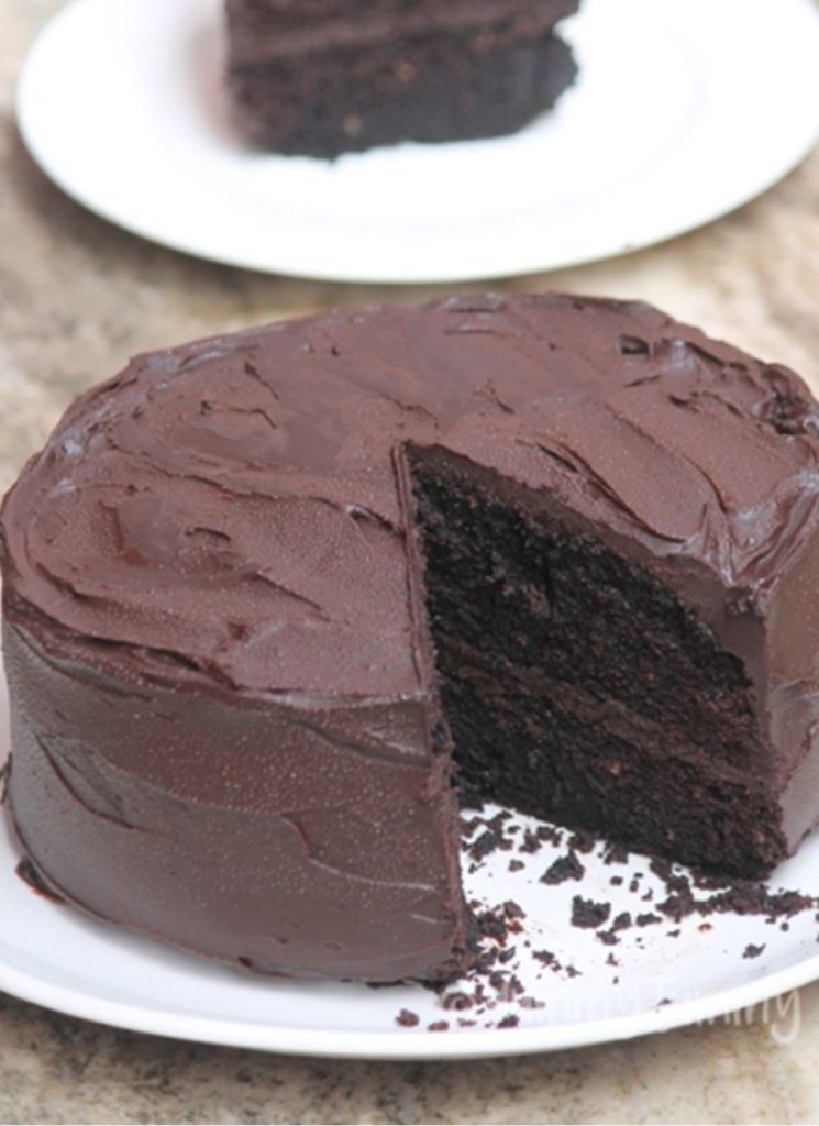 whole Eggless Chocolate Cake with one slice removed
