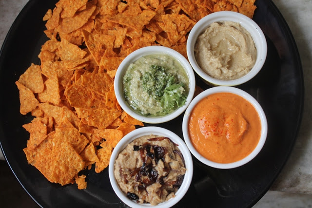 hummus platter with 4 flavours of hummus and tortilla chips