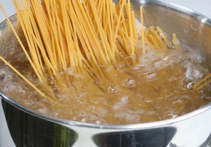 boil spaghetti in a sauce pan in salted water