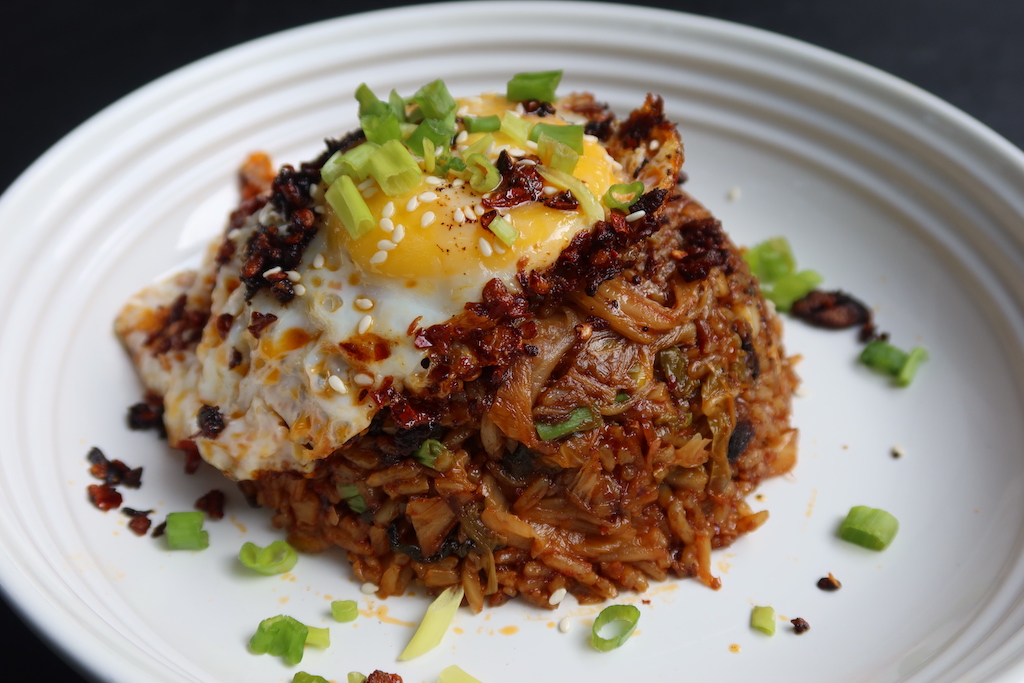 kimchi fried rice served with fried egg and chilli crisp